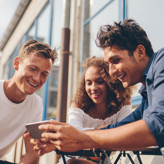 Friends watching a video on a smartphone