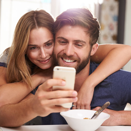 Couple looking at a smartphone